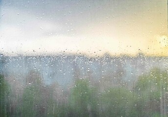 Raindrops on a window with a blurred view of a natural landscape during sunset. Soft light, gentle colors create a peaceful background texture perfect for designs, calming atmospheres, or artistic use