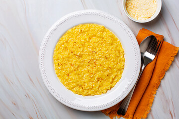 Italian dish made from saffron, rice, butter, hard cheese and vegetable broth. Risotto alla...