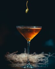 Vertical shot of a cocktail against a dark background.