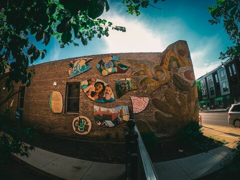 Artistic Mural On A Brick Walled Building Along Chicago Streets