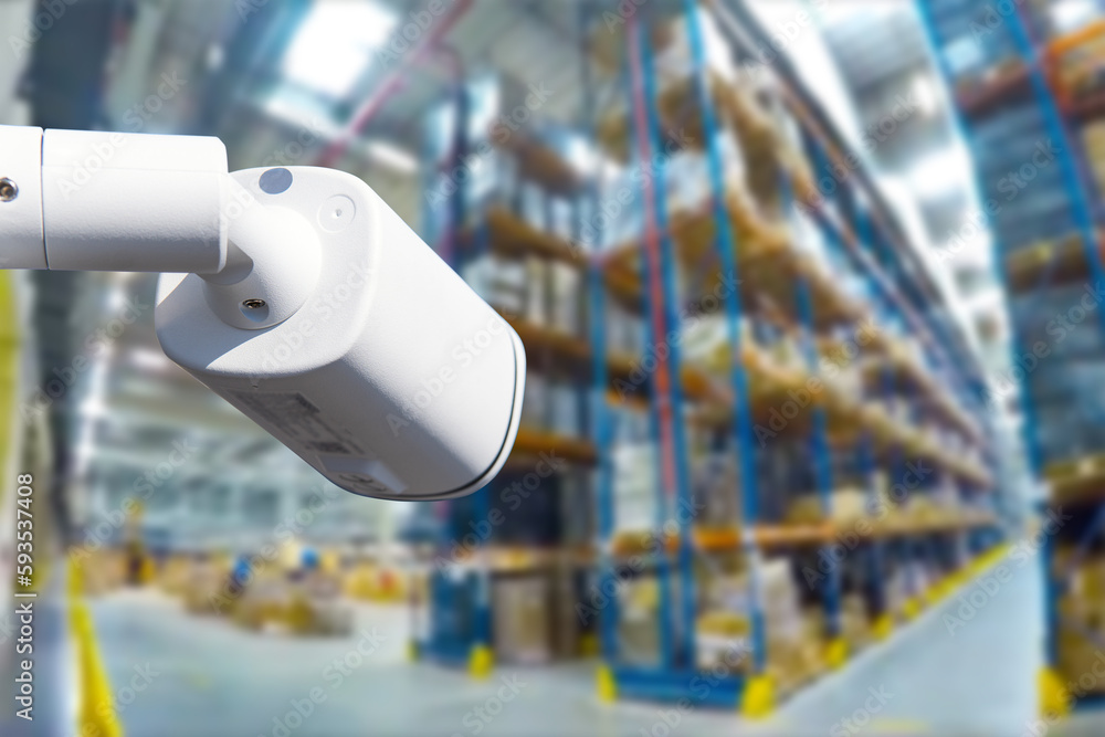 Poster closed circuit camera multi-angle cctv system against the background of a modern warehouse complex. 