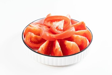 Closeup of slices of tomatoes on bowl