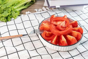 Closeup of slices of tomatoes on bowl