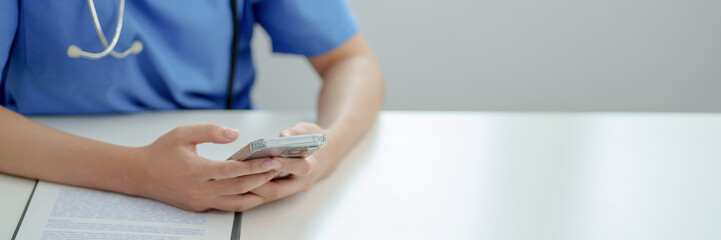 Medicine doctor using smartphone for Consultation Online.