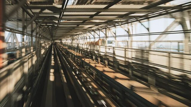 Point of view Yurikamome line automated train moving forward crossing Rainbow bridge to Odaiba in Tokyo, Japan. Advanced transportation system, Asia tourism, transport technology concept