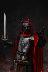 Art of esoteric knight of dark cult with horned mask and red robe.