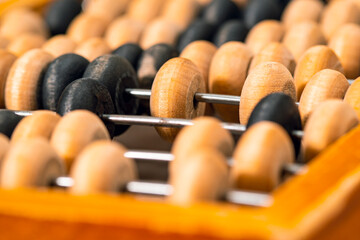 Close-up photo of vintage wooden abacus for calculation