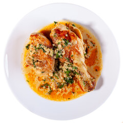 Shkmeruli is a traditional Georgian dish of chicken in garlic sauce in the white plate, isolated on white