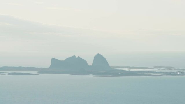 Stunning Natural Landscape Of Traena In Fog Seen From Lovund, Norway. wide