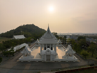 Chonburi, March 12, 2023. Wat Phon Prapa Nimit, This striking white Buddhist temple in a tranquil...
