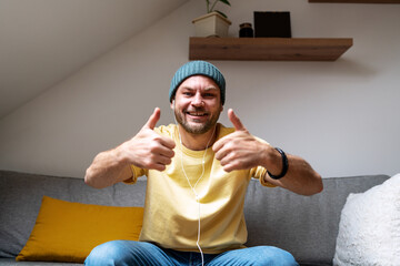 The man expresses his consent and gives a thumbs up to the camera.