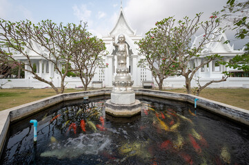 Chonburi, March 12, 2023. Wat Phon Prapa Nimit, This striking white Buddhist temple in a tranquil...