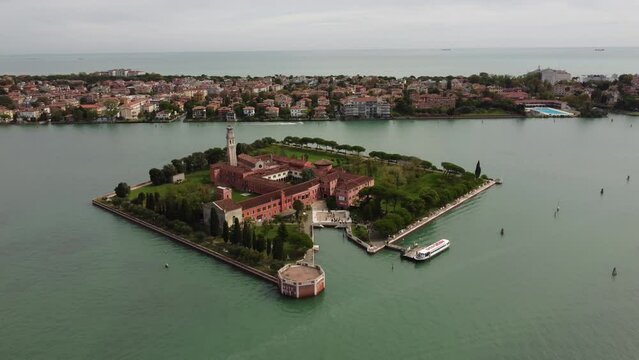 Drone view of the island of San Lazaro degli Armeni, moving back