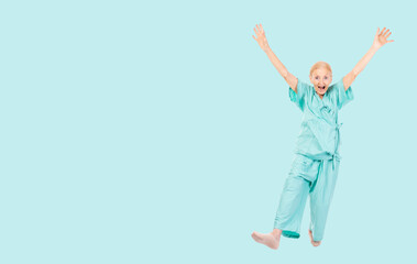 Fototapeta na wymiar Full body Cheerful Elderly patient woman wearing patient uniform looking to camera Old lady raised hands and leg dance Health care and Insurance concept isolated over green background copy space