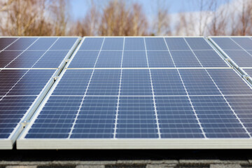 Energy-efficient country house. Solar panels on the roof. Electrification with renewable energy...