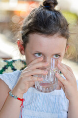 Close up of girl drinking water 