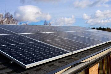 The roof of a country house on which solar panels are installed. Eco-friendly way of electrification
