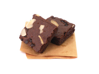 Fototapeta na wymiar Brownies on paper isolated white background. Chocolate brownie with sliced almond nuts toppings. Chocolate Brownie pieces. selective focus.