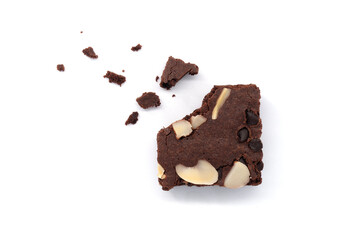 Brownies with crumbs isolated white background. Chocolate brownie with sliced almond nuts toppings. Chocolate Brownie pieces. selective focus. Top View.