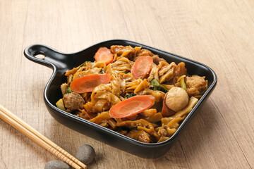 Kwetiaw or Kwetiau, fried rice noodles with meatballs and vegetables. Popular in Indonesia
