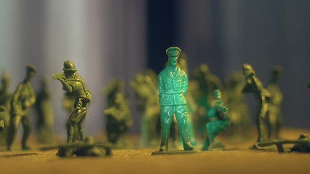 Toy soldiers standing on battlefield shoulder to shoulder. Violence war resistance and peace without armored invasion