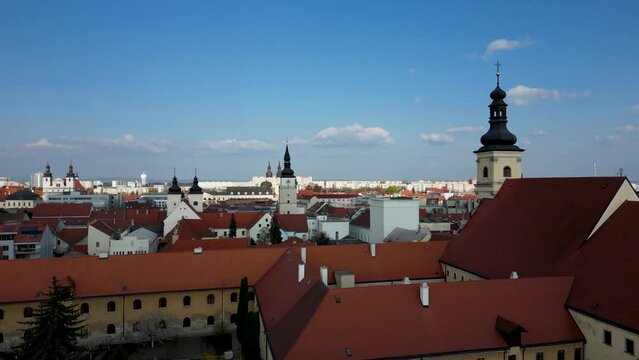 Drone is taking off over the town of Trnava, Slovakia, old town district, 4k
