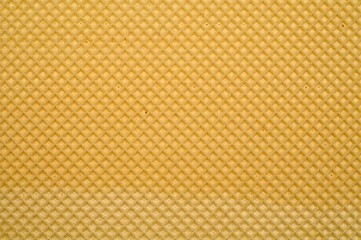 Closeup shot of the texture of a freshly-baked waffle