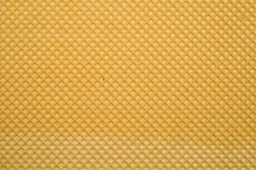 Fotobehang Closeup shot of the texture of a freshly-baked waffle © Ervin Salgo/Wirestock Creators
