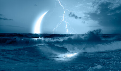 Abstract dark blue background with crescent in the sea with lightning , strong waves in the foreground at night 
