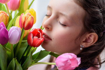 Close up of girls face with tulips