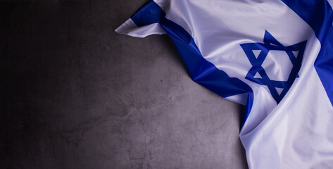 Official flag of Israel on a dark grey background.