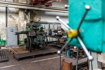 Old equipment, machines, tools in a rustic style in an abandoned mechanical factory