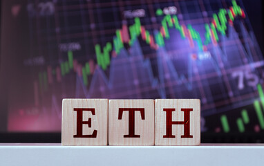 ETH - acronym from wooden cubes with letters, Ethereum. Financial market concept