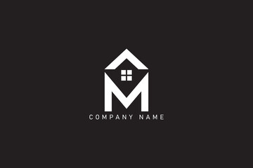 Fototapeta premium M and real Estate logo design 
