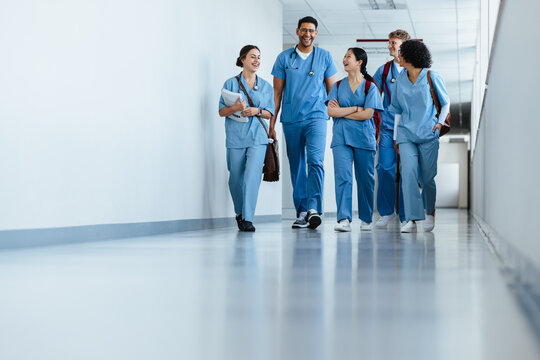 Medical team in training: Group of intern doctors walking in a hospital