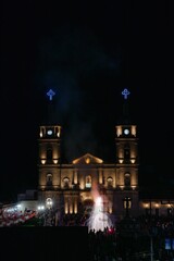 Vertical shot of fireworks in front of church during city's holidays of Tuxpan Jalisco, Mexico