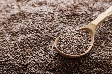 flax seeds in a wooden spoon