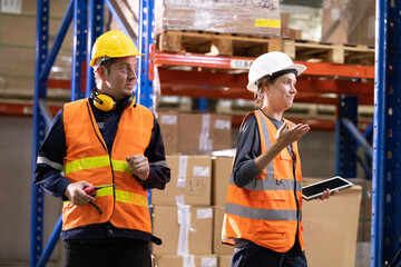 Two warehouse partners are unhappy and making serious gestures at each other because of poor...