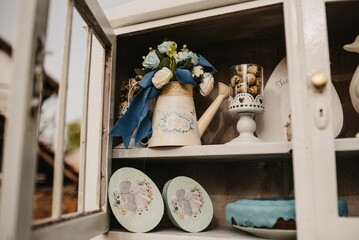 Flowers, cookies and cakes in the shelf for Easter decoration