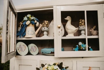 Flowers, cookies and cakes in the shelf for Easter decoration