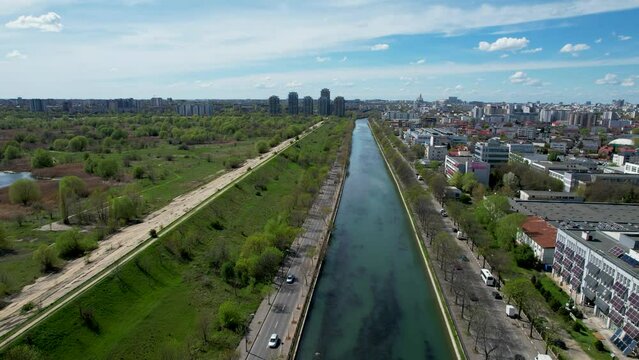 Captivating Bird's Eye View of Dambovita River, Vacaresti Delta, and Verdant Surroundings Against a Serene Blue Sky, Summer, Spring Bucharest, Romania