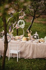 Vertical shot of the beautiful Easter table with egg cakes and decorations