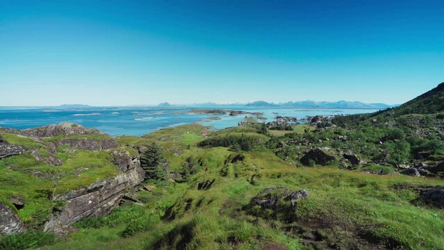Clear Blue Sky Over Lovund Island Off The Coast Of Norway. pan left