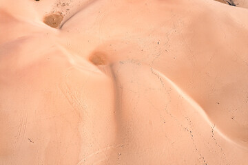Wind wave vortices in sand background from aerial top view