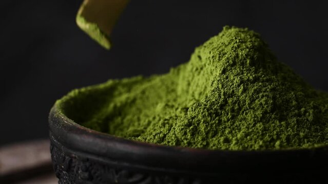 Matcha green tea powder hill rotating close up view