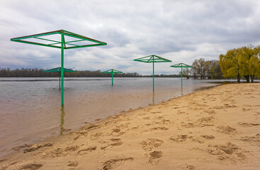 Flooded beach in Kremenchuk city, Ukraine. The water level in the river rises during the spring flood