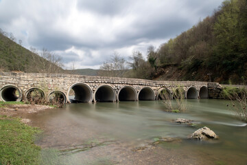 Fototapeta premium Waterfall. Long exposure waterfall photo. Stream. Long exposure.Long exposure photo of smooth waterfall flowing through steps.Hacilli waterfall. Türkiye.