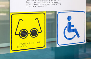 Signage plate for disabled people with braille inscription