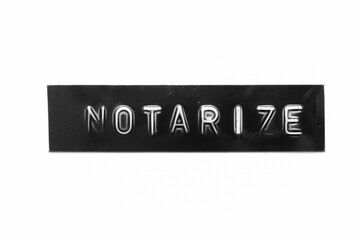 Black color banner that have embossed letter with word notarize on white paper background