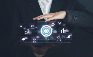 Business targeting concept. Businessman touching darts aiming at target center with digital marketing icons on virtual screen internet network connection, Business goal, Digital online marketing.